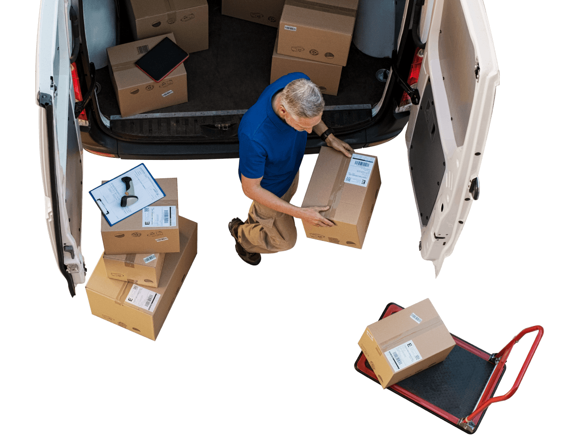 a man loading boxes into a van