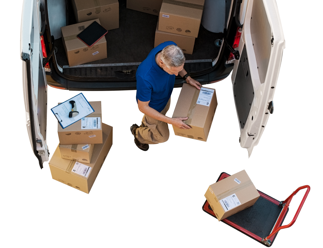 a man loading boxes into a van